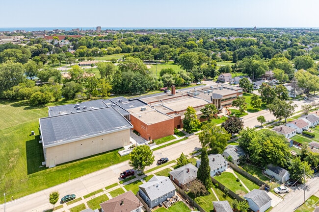 Racine Lutheran High School is surrounded by greenery and trees in Racine's Island Park area.