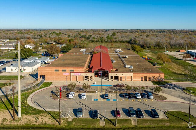 Nestled along I-10, Harlem Elementary, with its red and white hues, is a beacon of education.