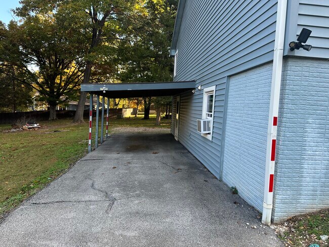 Private entrance and carport
