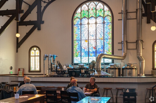Enjoy a beer in an old church building featuring fabulous light.