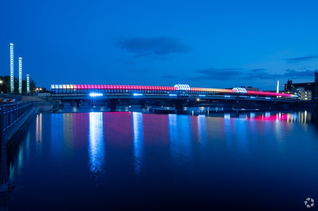 The colorful lights of ConWay Pedestrian Bridge illuminate evenings for Liberty Park residents.
