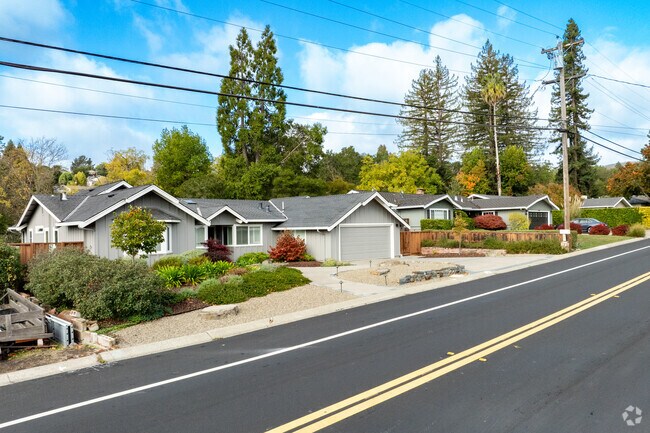 Neat landscaping, classic ranch homes, and quiet roads capture the everyday ease of life on Ivy Drive.