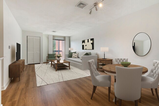 Renovated Package III dining and living room with hard surface flooring