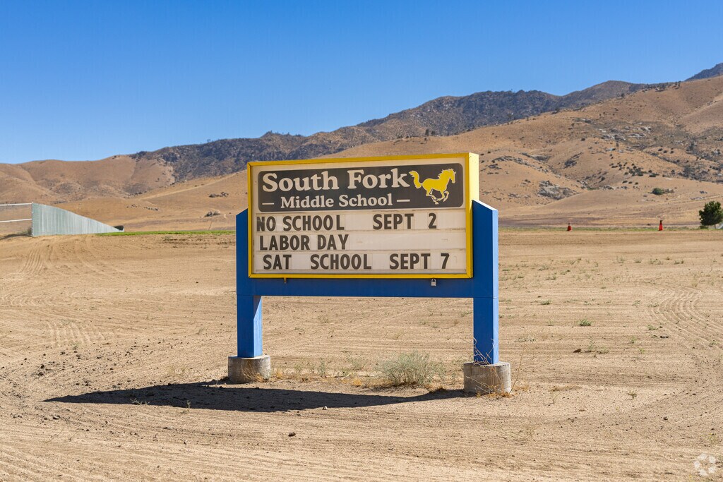 A large marquee at the entrance to South Fork Middle School displays upcoming events.