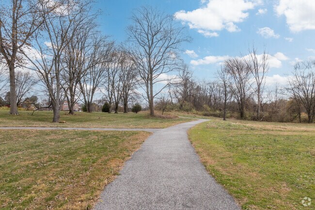 Paved trails in New London Township Park offer easy walks for dogs and their owners alike.