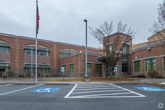 Ridgeview Elementary features a tall flagpole in front of the entrance.