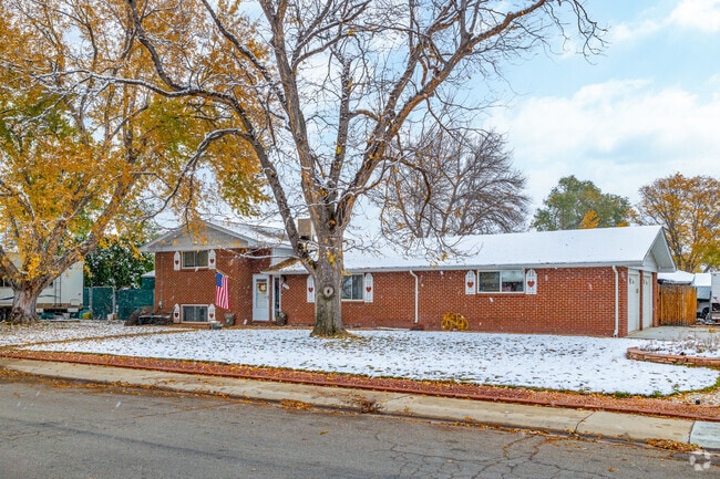 A split-level home sits under tall trees in Terry Lake.