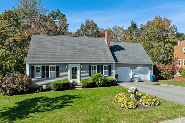 A cape style home with a well-kept lawn in Rutland.