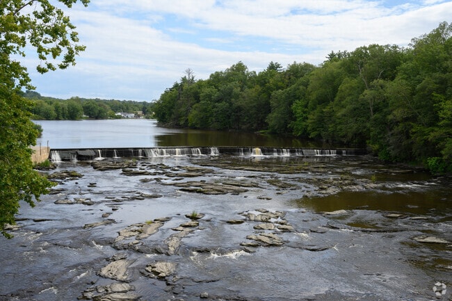 Pedestrians on the Stewart Crowell bridge get a view of the Wallkill River Dam.