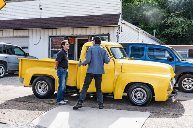 Friends gather to talk about classic cars in Manor, PA.