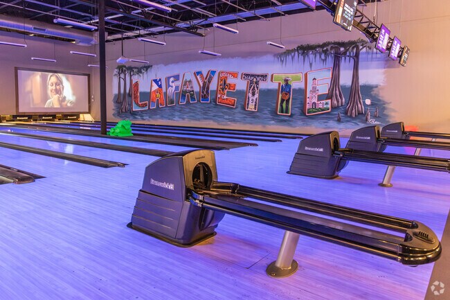 Neon disco bowling at Surge Entertainment by Drew Bees is a great activity for the whole family in Pilette.