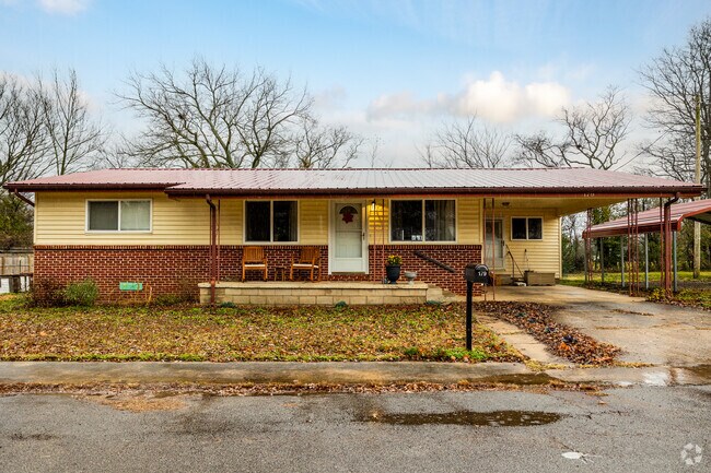 A traditional ranch home with a metal roof in the heart of West Fork.