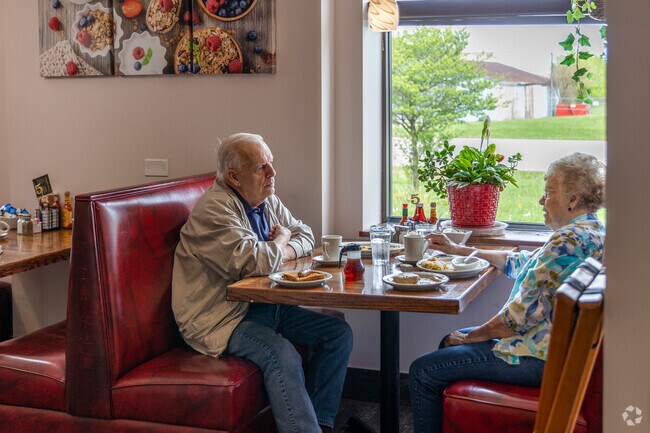 Couples enjoy a quiet breakfast in the Sugar Grove Cafe.