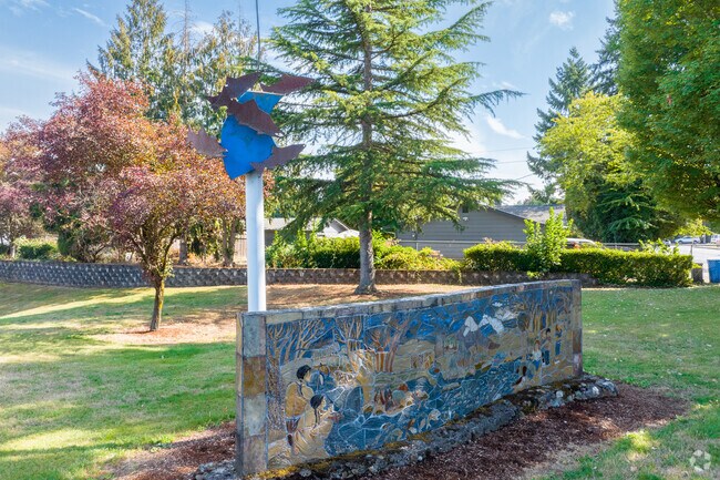 A stone mural on NE 130th Ave illustrates the history of the Vancouver area in North Image.