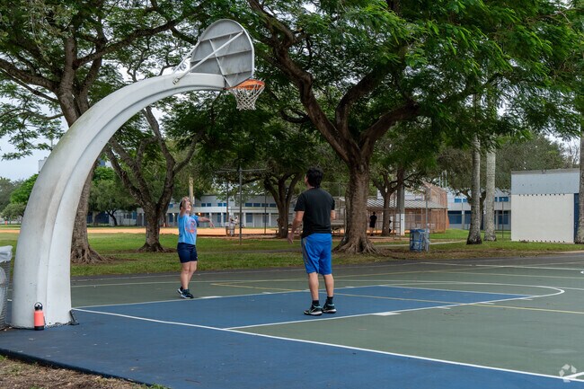In Kenland, residents enjoy a friendly game of basketball at nearby Devon Aire Park.