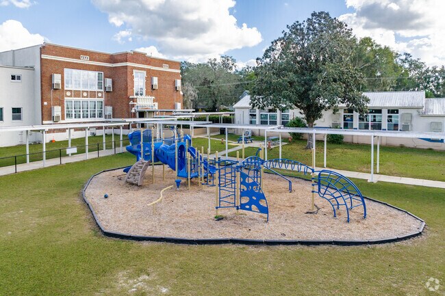 Kids enjoy playing on the play area at Rodney Cox Elementary.