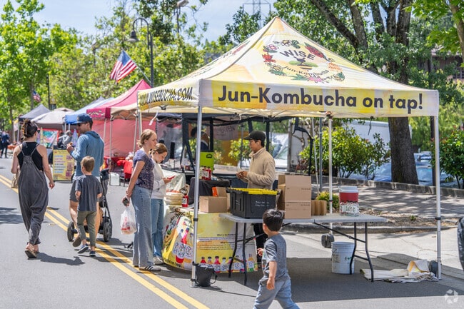 A shopper samples fresh kombucha from local vendors at Orinda Farmer's Market.
