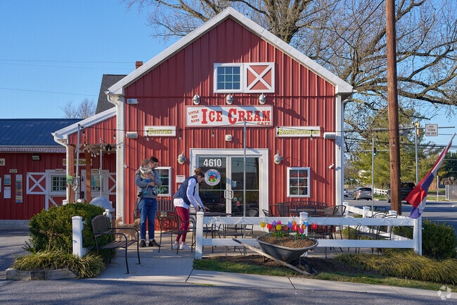 A family enjoys a spring day at the Little Red Barn Ice Cream Cafe.