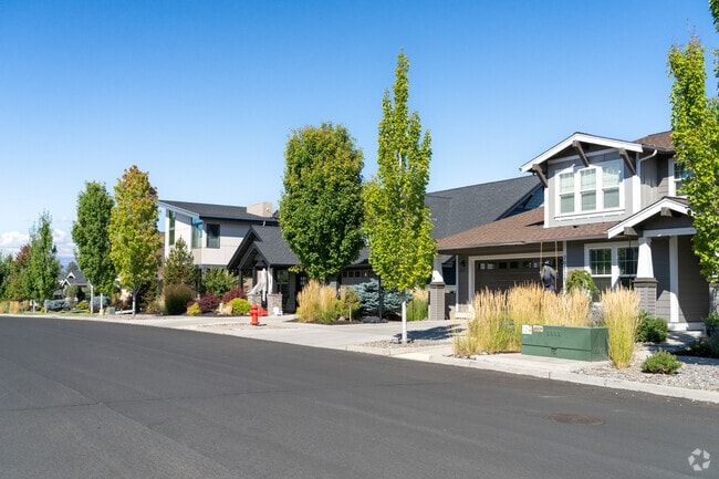 Southeast Bend homes, each with unique designs and lush gardens lining the street.