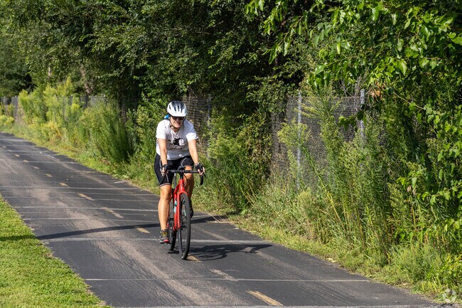Cyclists love the Cedar Lake Trail in Nelson Park because it's free from cars and traffic.