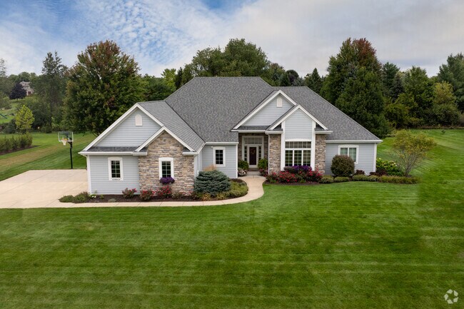 New traditional homes in Lisbon often have well-manicured front yards.
