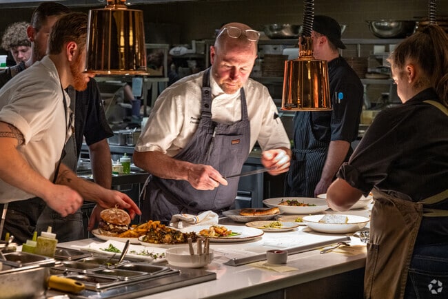 The executive chef at Ninety Acres in Peapack-Gladstone checks the flavor and look of each dish.