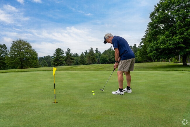 A golfer practices their putt before they tee off at Worthington Links.