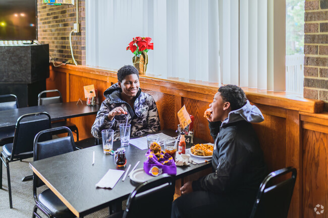 A couple of friends enjoy a meal at Gregory's Soul Food in the Turner-Dodge neighborhood.