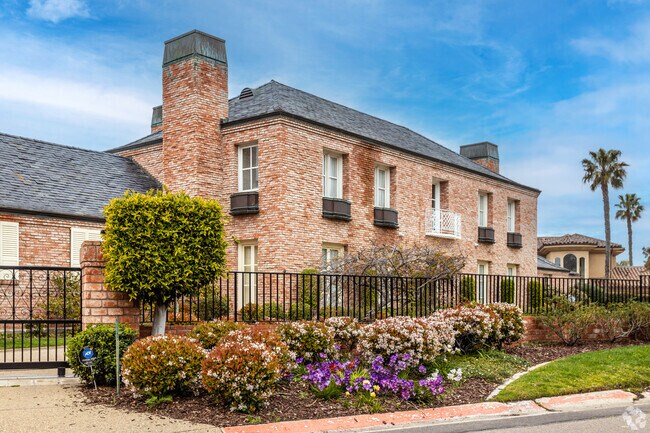 A colonial-style brick stone estate in La Jolla Farms.
