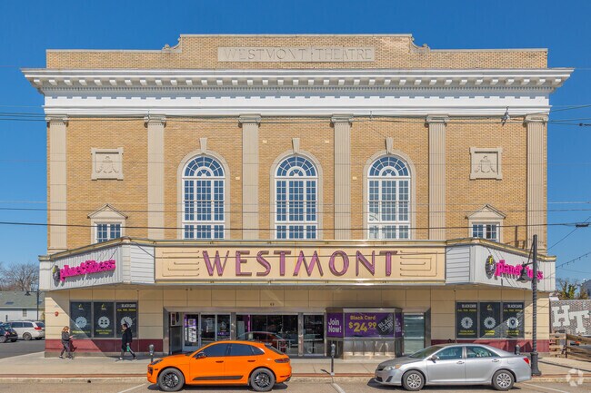 The marquee on the Westmont Theater was relit several years ago when Planet Fitness moved in and retained the historic façade.