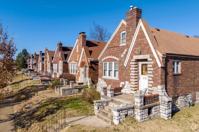 Tudors in North Pointe often have red brick facades and snow-white cornices.