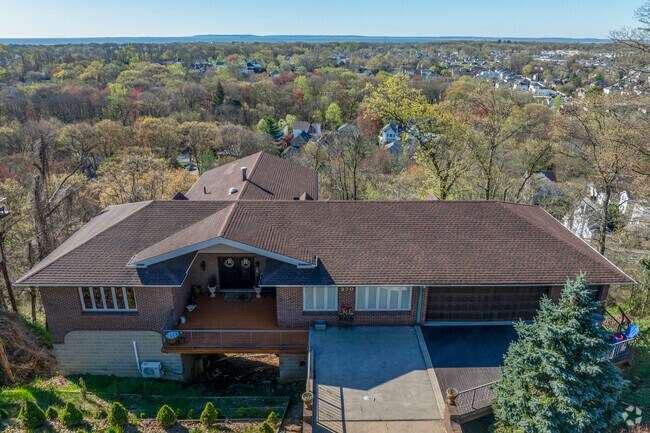 Lighthouse Hill is a serene and affluent neighborhood perched atop a hill in Staten Island.