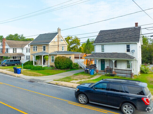 20th Century Farmhouses coexist with shopping on the Lincoln Highway.