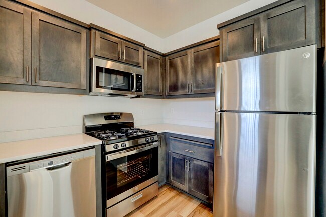 Kitchen with gas range and microhood