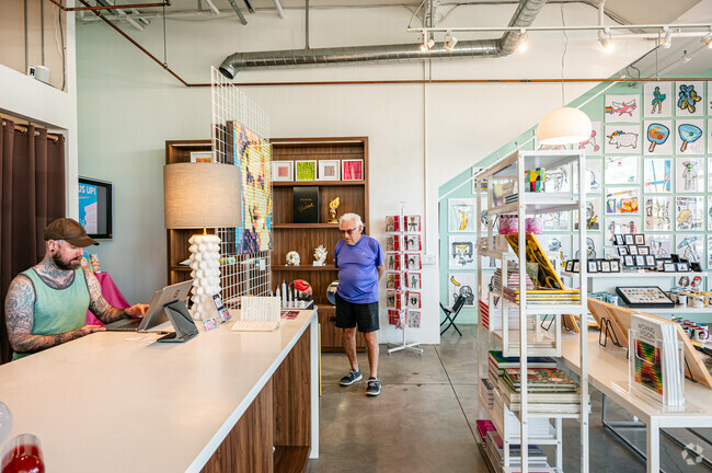 Visitors enjoy browsing and shopping for art at Trevor Wayne in Old Las Palmas.