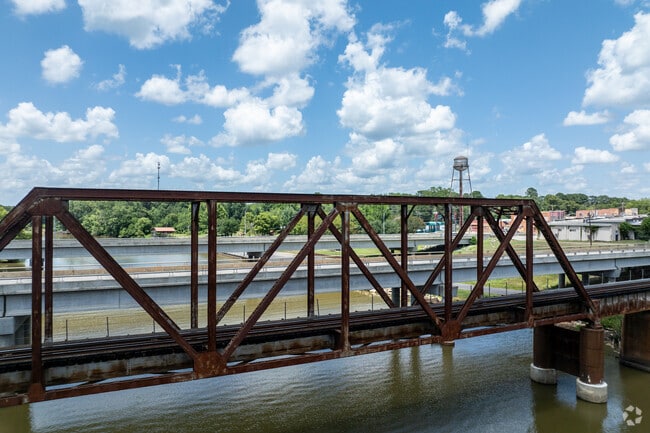 The railroad tracks cross the Sabine River bridge just outside Stanley, marking the TX–LA border.