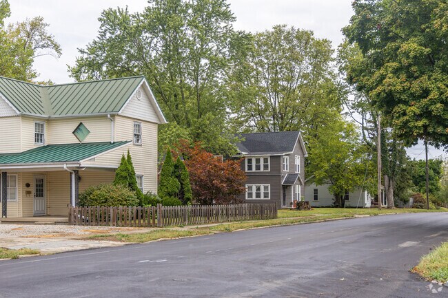 A row of traditional two-story homes lines the street in Downtown Yorktown, Indiana.