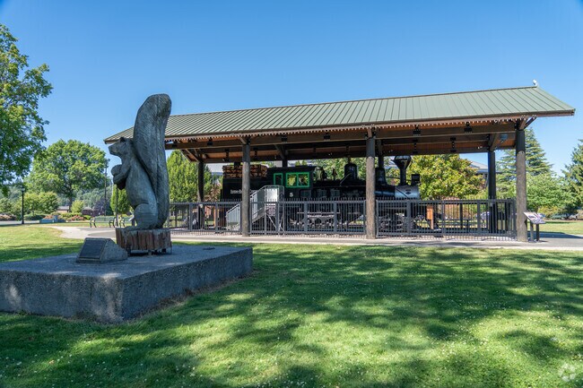 Glenwood's park features a whimsical squirrel statue and a preserved historic locomotive.