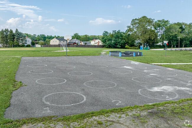 Students practice teamwork on the basketball court at Robert B. Jaggard Elementary School.