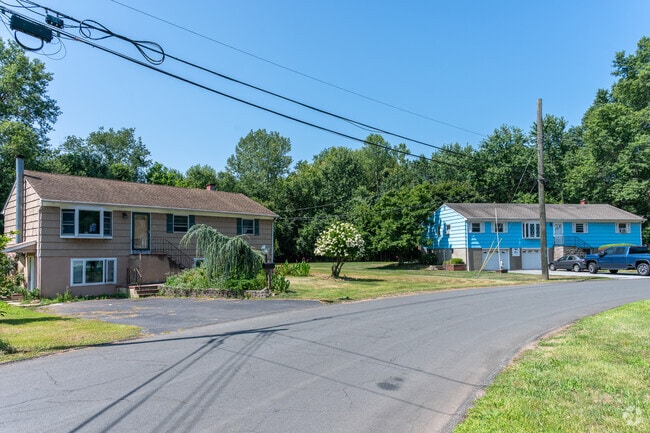 Power lines run throughout the neighborhood, hanging over the streets.
