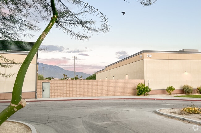 The Sun sets over the mountains at Rancho Mirage High School.