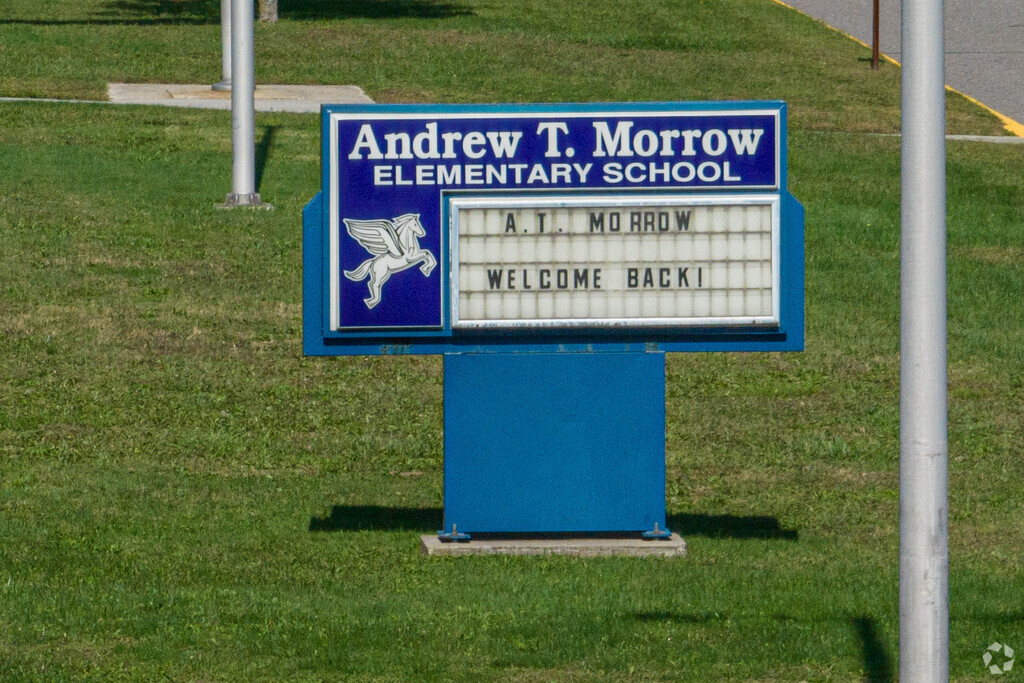 Blue and white are the colors of the school as seen here on the sign.