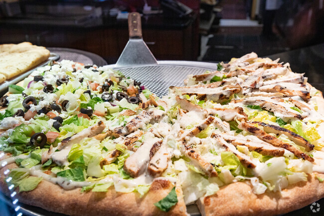 Try their mouthwatering Chicken Caesar Salad Slice