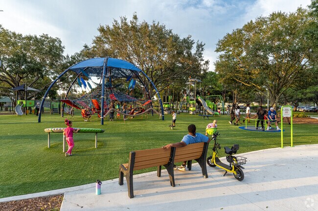 Families can unwind at the playground in Whispering Pines Park.