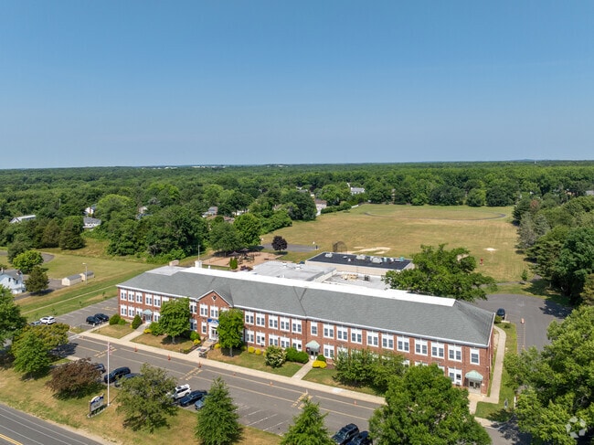 Central Elementary School is surrounded by trees and greenery.