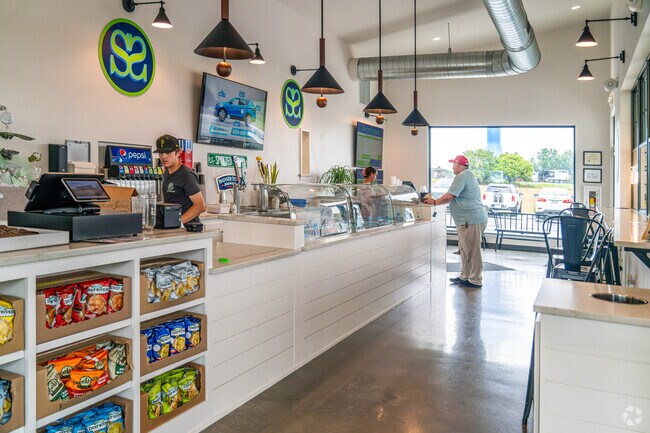 A local orders lunch at Scott's Subs in McAuliffe Park.
