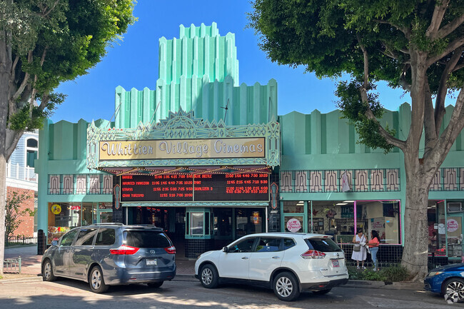 Whittier Village Cinemas is a historic building in beautiful seafoam green.