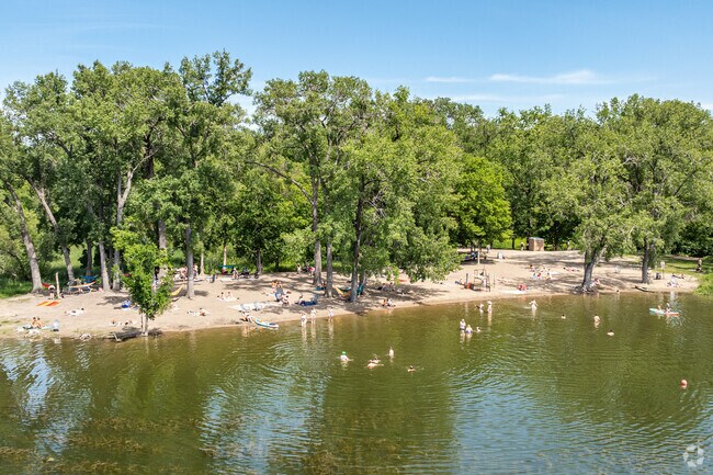 Residents enjoy a day at the beach at Cedar Lake East Beach.