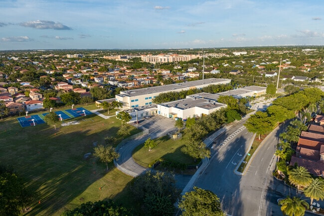 Sunset casts a beautiful glow over Christina M. Eve Elementary School in an aerial view.