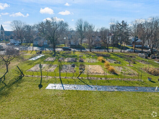 There is a garden that's located in the back of the school building.
